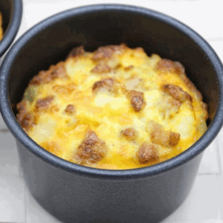 Air Fryer Egg Bites with Sausage cooked and on the kitchen table.