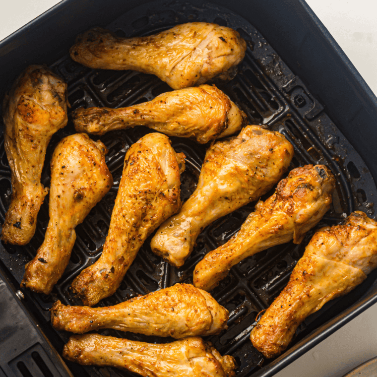 Golden and crispy air fryer frozen chicken drumsticks, cooked to perfection.