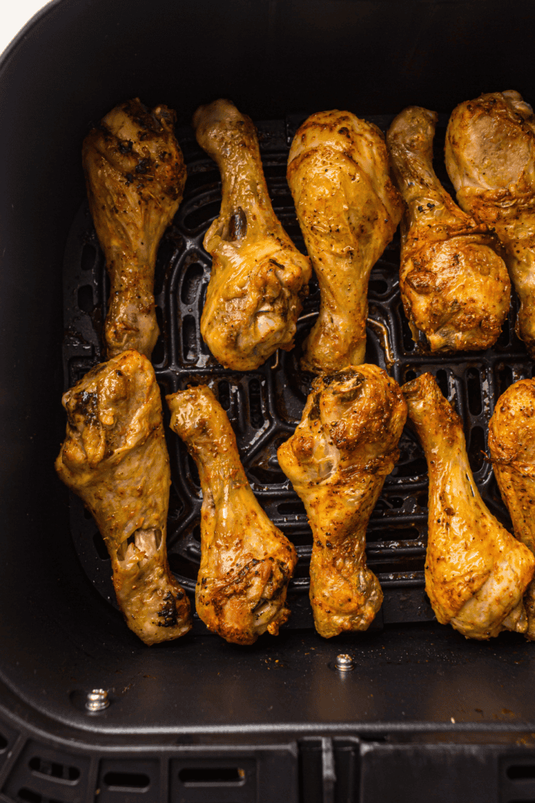 Cooked crispy Air Fryer Frozen Chicken Drumsticks, perfectly seasoned and golden.