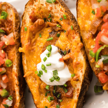Air Fryer Loaded Potato Skins are a mouthwatering appetizer that combines the irresistible crunch of potato skins with a savory and cheesy filling. This classic pub-style snack gets a healthier and faster makeover in the air fryer, making it the perfect choice for game day gatherings, parties, or a delicious indulgence anytime. Get ready to savor the crispy potato skins loaded with bacon, cheese, sour cream, and chives, all cooked to perfection in your trusty air fryer. It's a crowd-pleasing dish that's sure to disappear quickly, leaving everyone wanting more.
