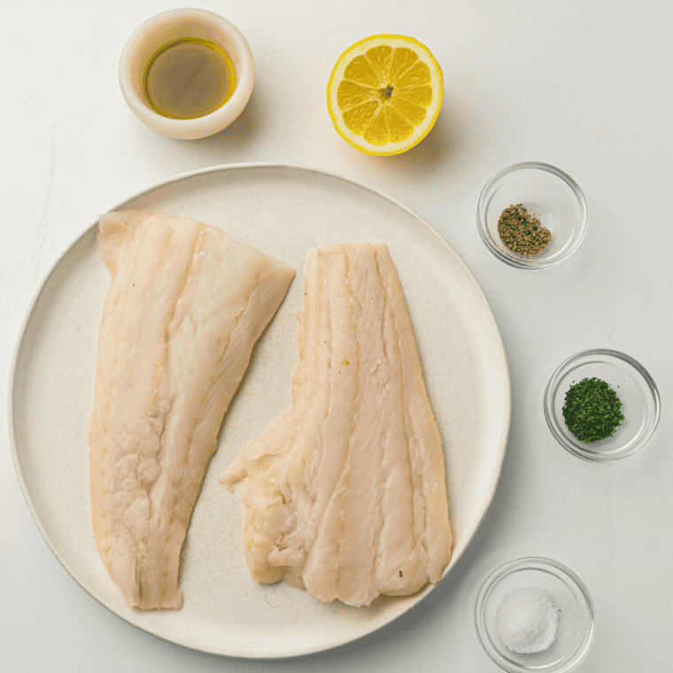 Ingredients Needed For Air Fryer Parmesan Crusted Cod On Kitchen table.