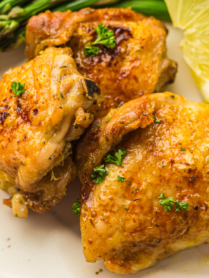 Air fryer turkey thighs on a platter garnished with fresh rosemary