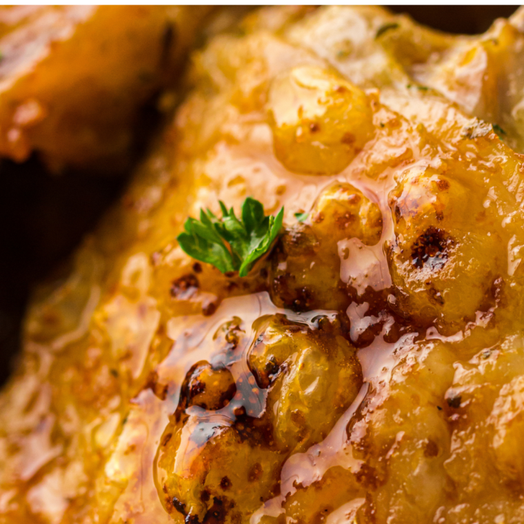 Air fryer turkey thigh served with stuffing and green beans on a dinner plate