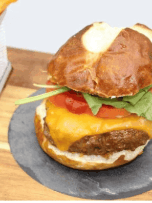 Homemade Arby’s BBQ Bacon Burger with crispy bacon, cheddar cheese, and smoky barbecue sauce on a toasted bun.