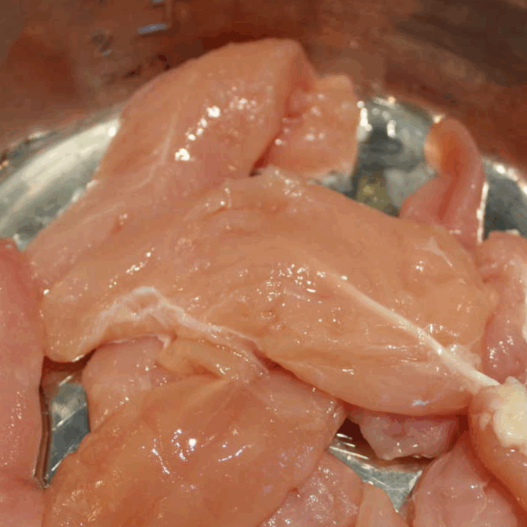 Place the chicken into the the Instant Pot.
