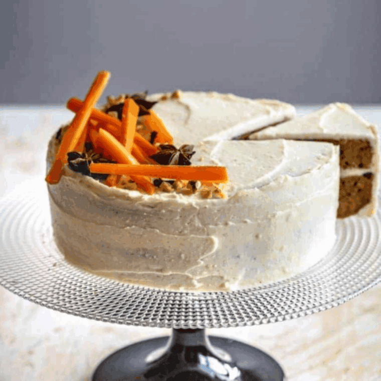 Slice of Carrot Cake Cheesecake with creamy cheesecake and spiced carrot cake layers