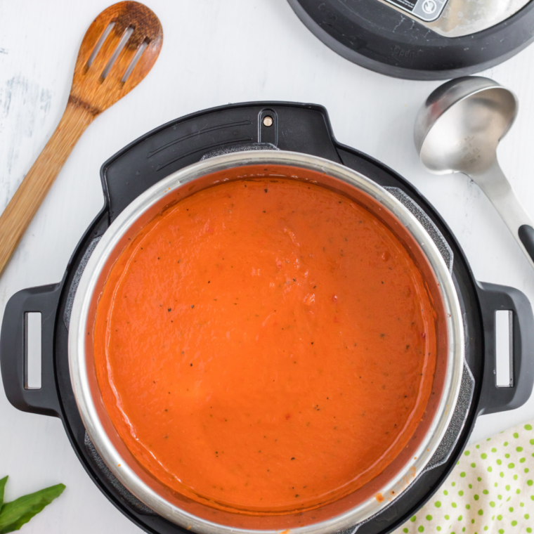 Instant Pot lid sealed with the valve set to sealing for pressure cooking tomato basil soup