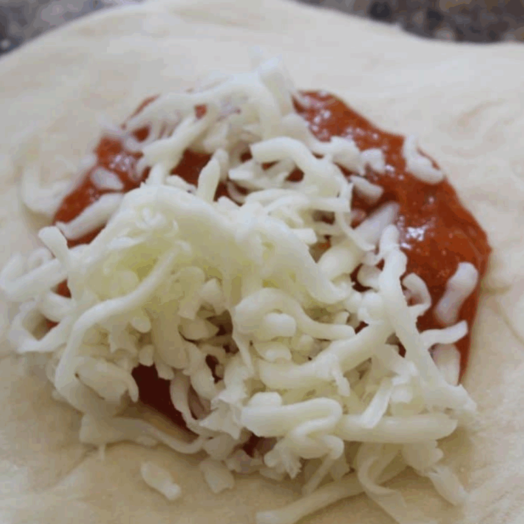 Add the fillings to the calzone dough.