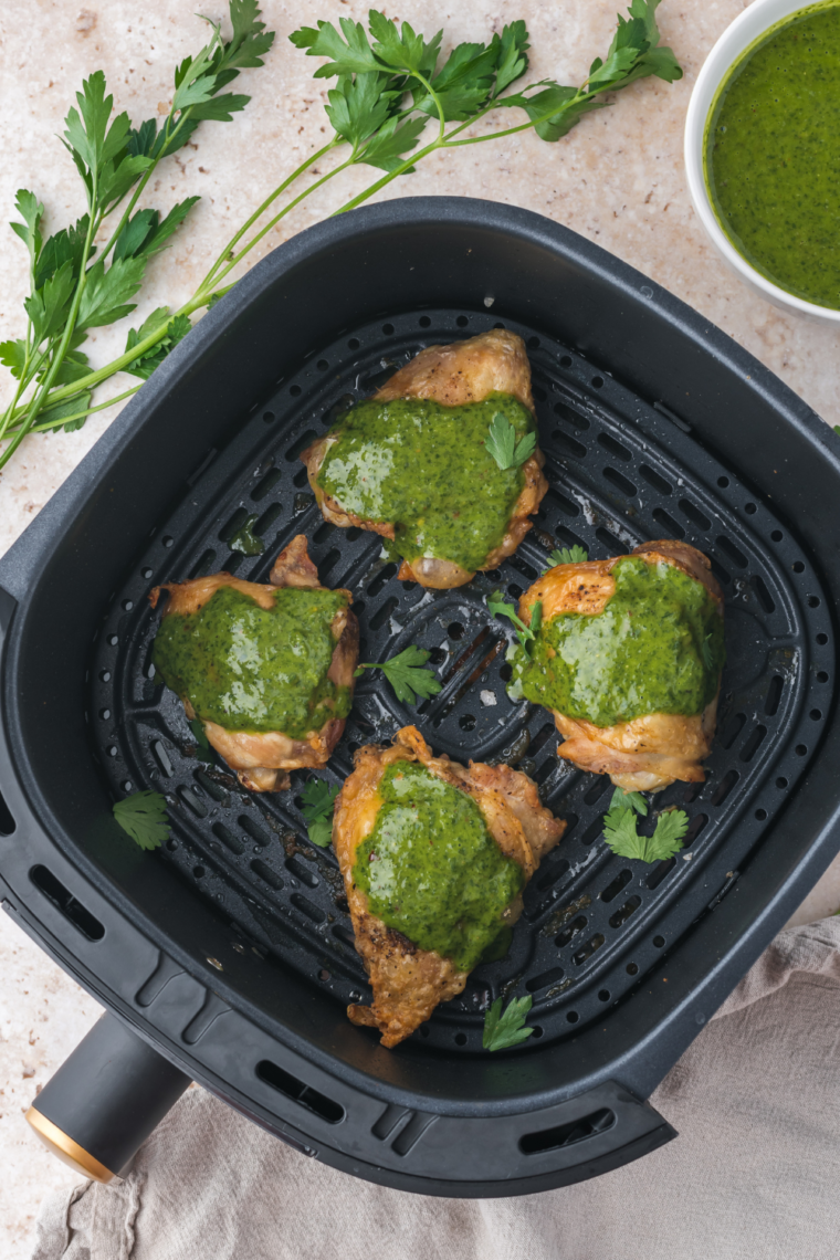 Air Fryer Brown Sugar Chicken Thighs served with sides on a dinner plate.