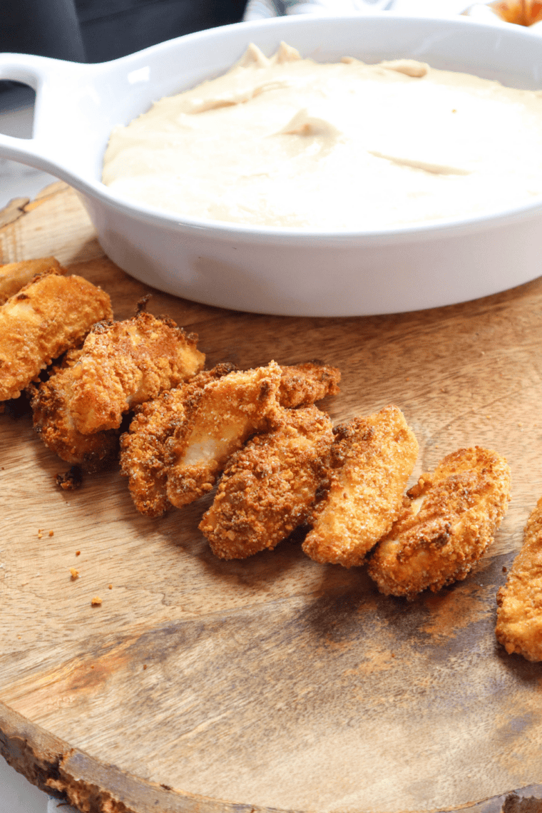 Bowl of smooth and creamy Auntie Anne&rsquo;s sweet caramel dip ready for dipping pretzels