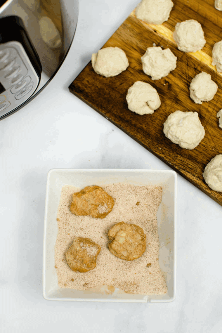 Cutting pre-made biscuit dough into small bite-sized pieces