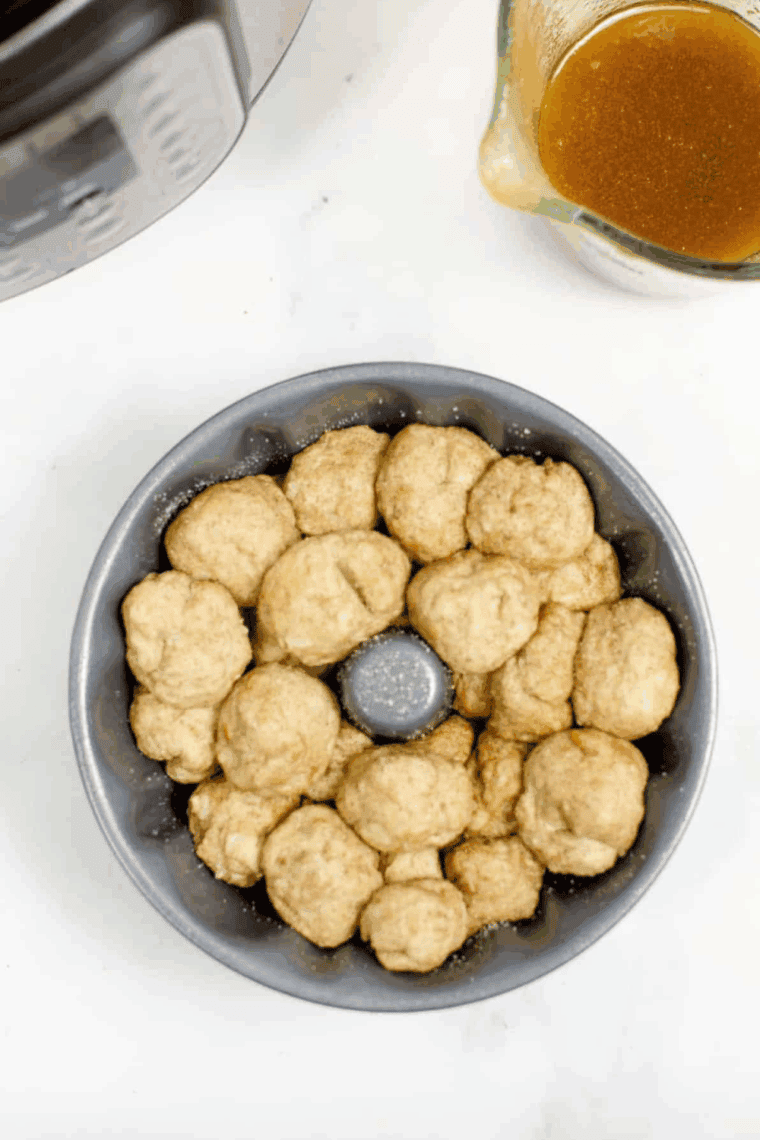 Placing Bundt pan on trivet inside Instant Pot, ready for cooking
