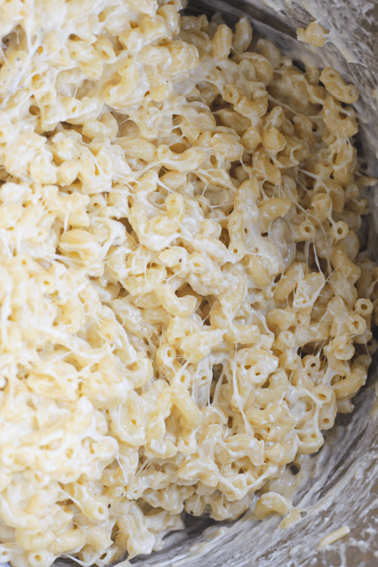Creamy and cheesy boxed macaroni and cheese cooked in the Ninja Foodi, served in a bowl.