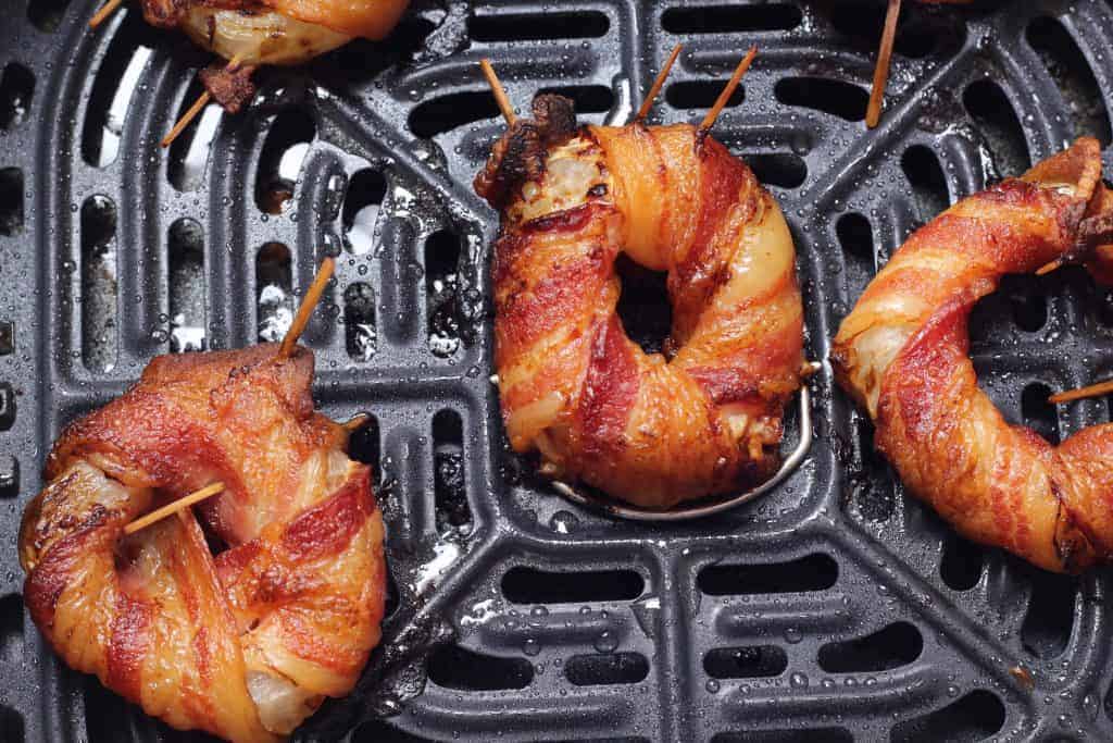 Bacon Wrapped Onion Ring in Air Fryer Basket