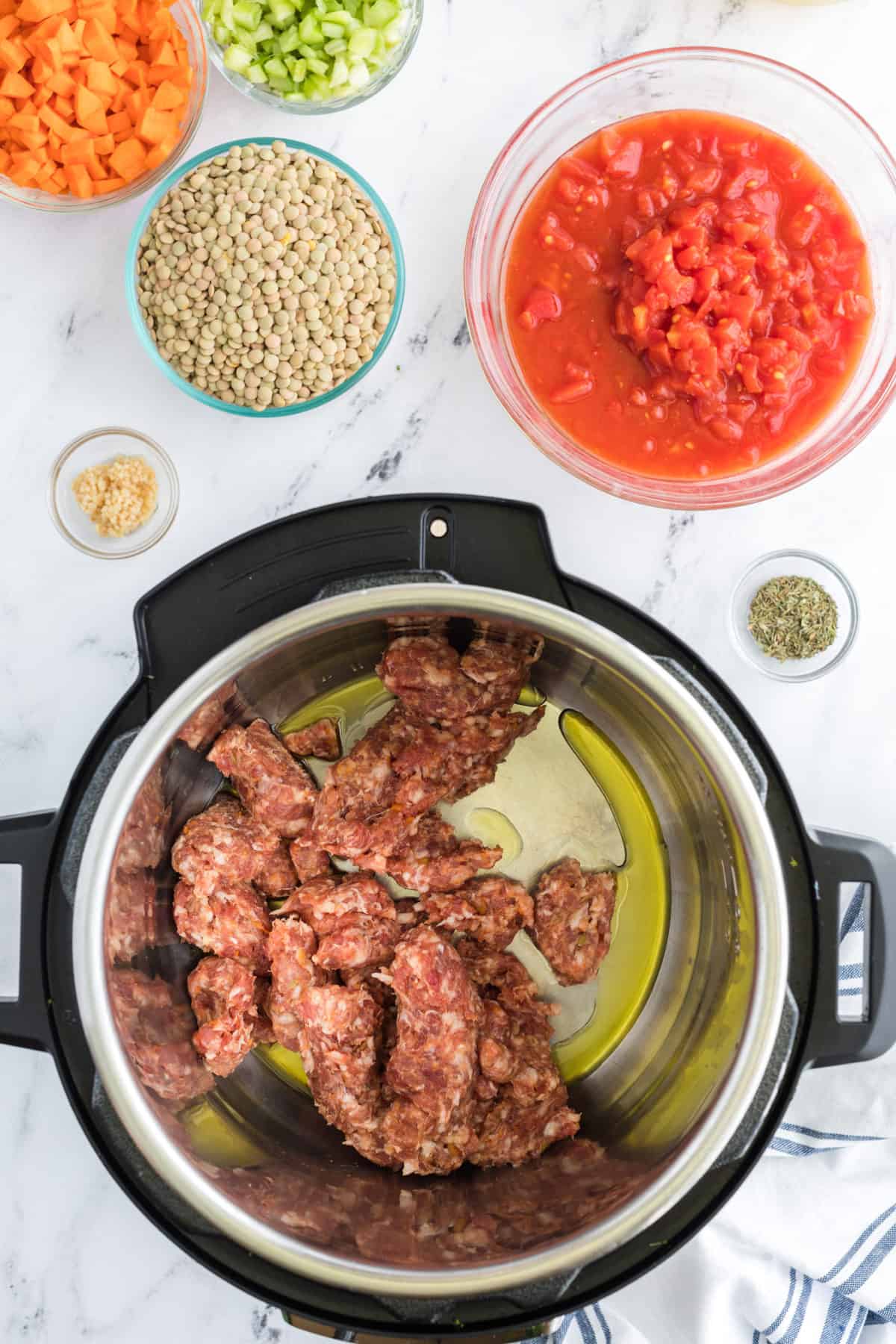 Instant Pot Sausage and Lentil Soup Sausage Being Cooked in Bowl