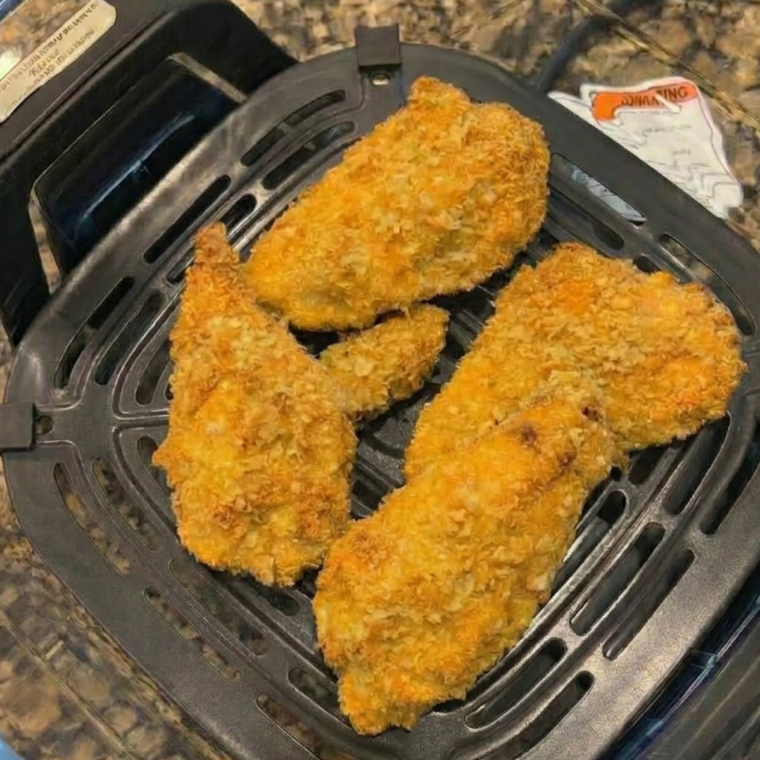 Golden crispy Ninja Crispi chicken cutlets with crunchy panko coating served on a plate.