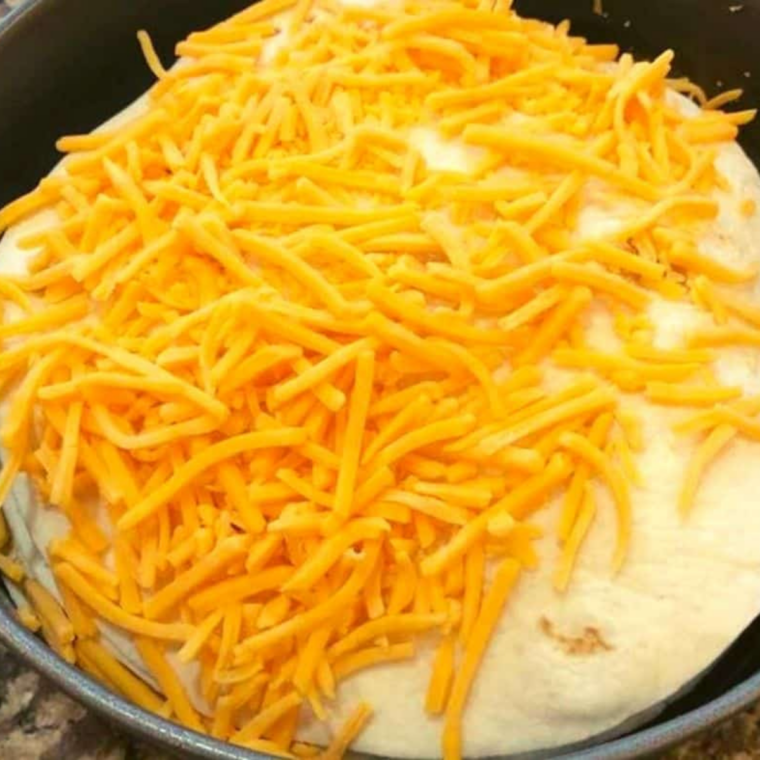 Taco pie in the Ninja Foodi air fryer with melted cheese on top