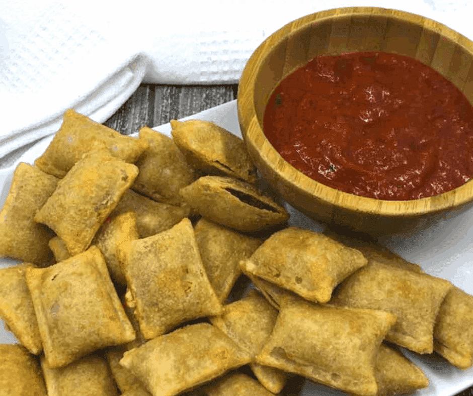 pizza rolls with a bowl of sauce