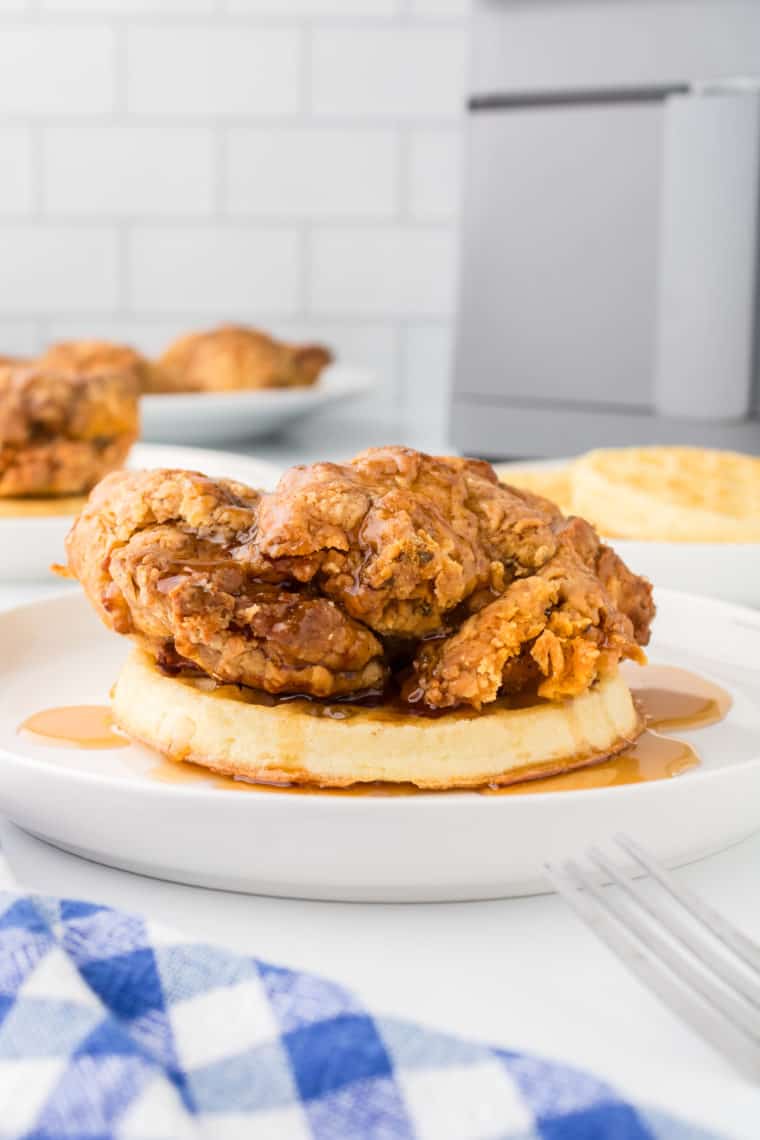 You'll love this Air Fryer Chicken and Waffles recipe for several compelling reasons:



Perfect Crispiness: The air fryer excels at cooking the chicken to a perfect crispy texture, giving you that delightful crunch with every bite without the heaviness of traditional frying.

Healthier Option: Air frying chicken uses significantly less oil than deep frying, making this a healthier take on classic comfort food.

Quick and Convenient: Unlike traditional frying methods, the air fryer speeds up the cooking process, allowing you to enjoy this indulgent meal in less time.

Flavorful and Versatile: The combination of savory, spiced chicken with sweet, fluffy waffles creates a beautiful balance of flavors that can be further enhanced with syrups, hot sauce, or your choice of toppings.

Perfect for Any Meal: Whether you’re craving a hearty breakfast, a fun brunch, or a comforting dinner, chicken and waffles are versatile enough to fit any mealtime. This is true comfort food that the whole family will love! 

Easy Cleanup: The air fryer makes cleanup a breeze with less oil splatter and mess than traditional frying methods.

Consistency: The air fryer provides consistent heat, ensuring that each piece of chicken is cooked evenly, eliminating the guesswork and potential for undercooked or overly crispy spots.

Enjoyable for Everyone: This dish is a crowd-pleaser, delighting kids and adults alike with its unique and delicious combination of flavors and textures.

In summary, Air Fryer Chicken and Waffles offer a delightful mix of ease, healthiness, and taste, making it a must-try for anyone looking for a new twist on traditional Southern cuisine.