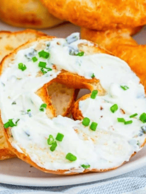 Close up of 2 ingredient bagels topped with cream cheese and chives