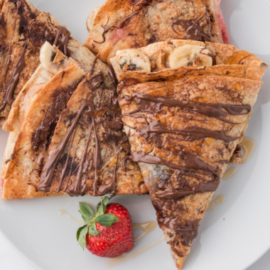 Air fryer banana Nutella quesadilla cut into wedges, melted Nutella and caramelized banana visible at the cut edge