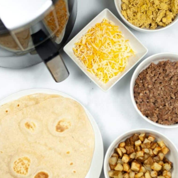 Ingredients needed for Air Fryer Breakfast Chimichangas on table.