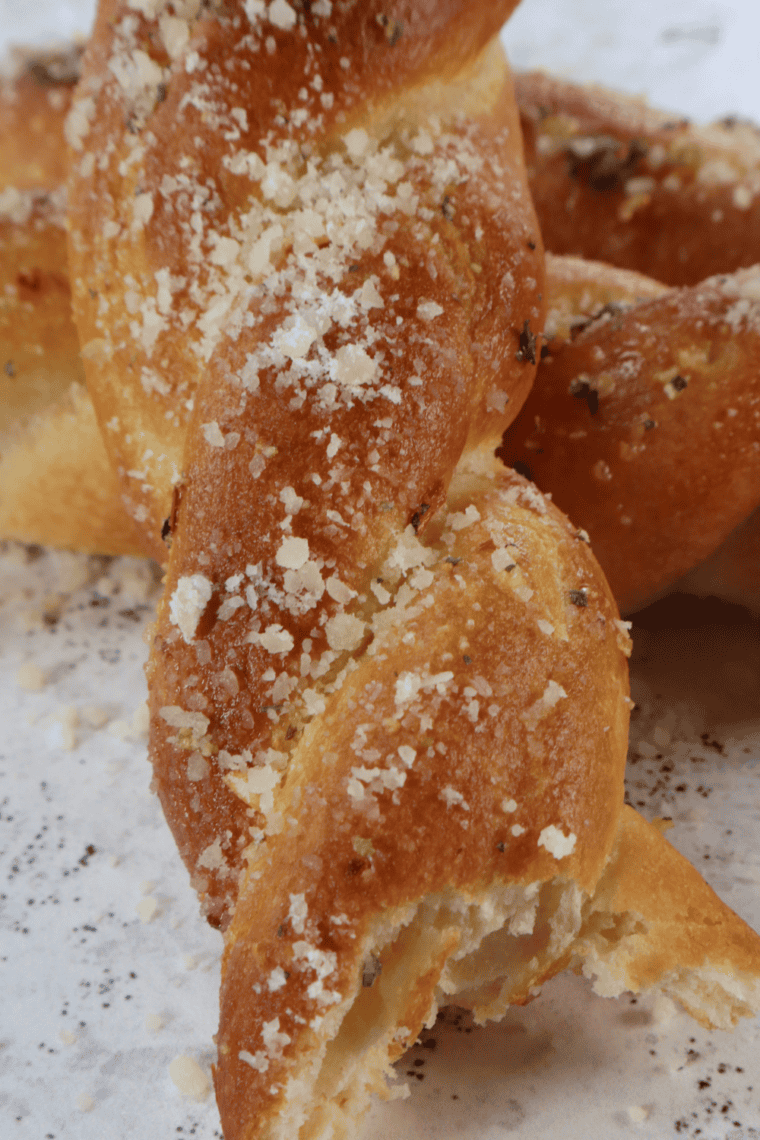 Air fryer copycat Domino’s bread twists served with garlic butter and Parmesan cheese.