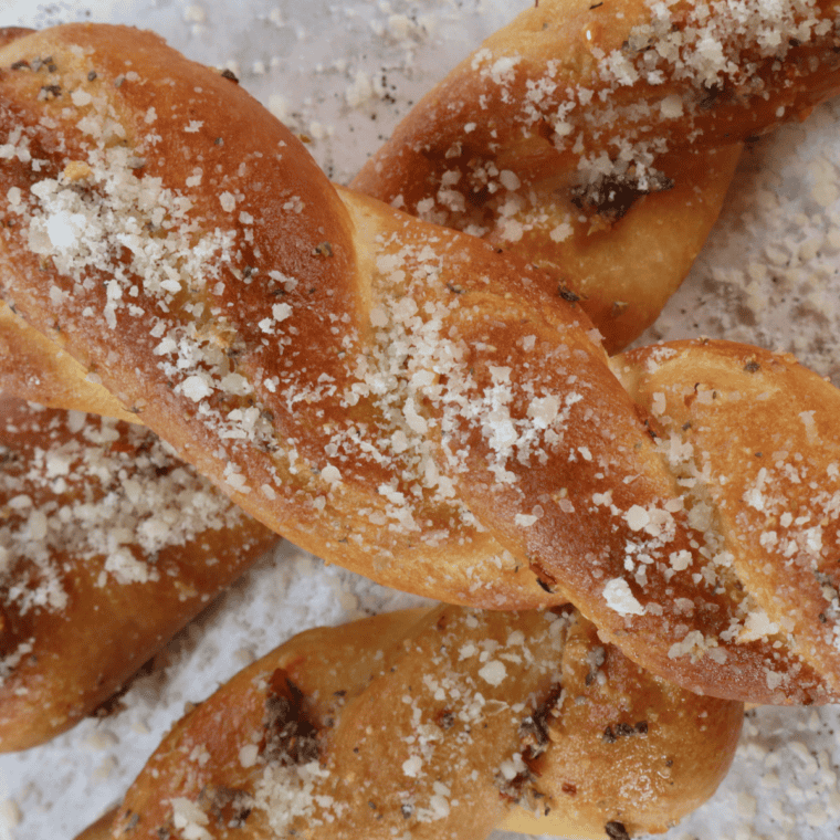 Air Fryer Copycat Domino's Bread Twists with crispy, golden-brown texture, topped with garlic butter and Parmesan cheese, ready to serve.