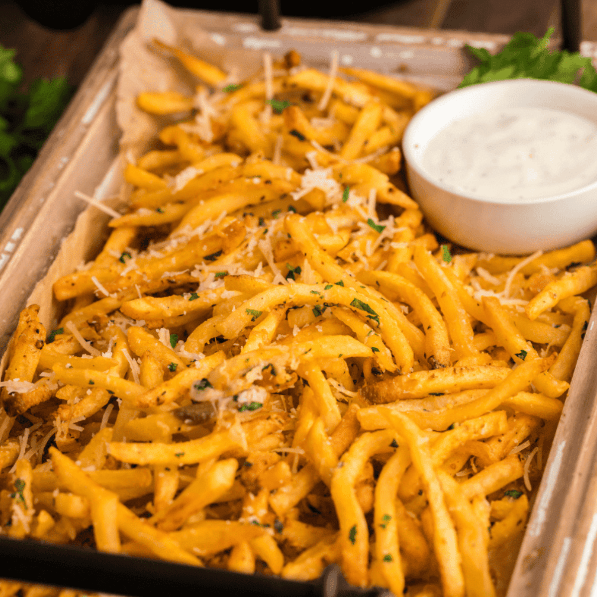 Golden SmashBurger-style fries in an air fryer basket, seasoned and ready to serve.
