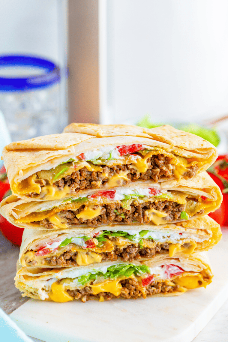 side view: a stack of air fryer crunchwraps cut in half so the fillings are showing