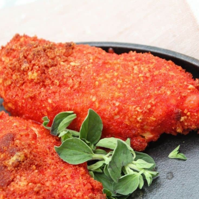 Air Fryer Flamin’ Hot Chicken Tenders with a crispy, spicy coating.