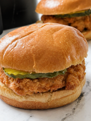 Crispy Aldi Red Bag Chicken fillet on a toasted brioche bun with dill pickles, cooked in the air fryer