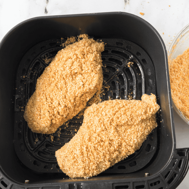 Chicken coated in Shake 'n Bake crumbs in a bag for air fryer shake and bake chicken
