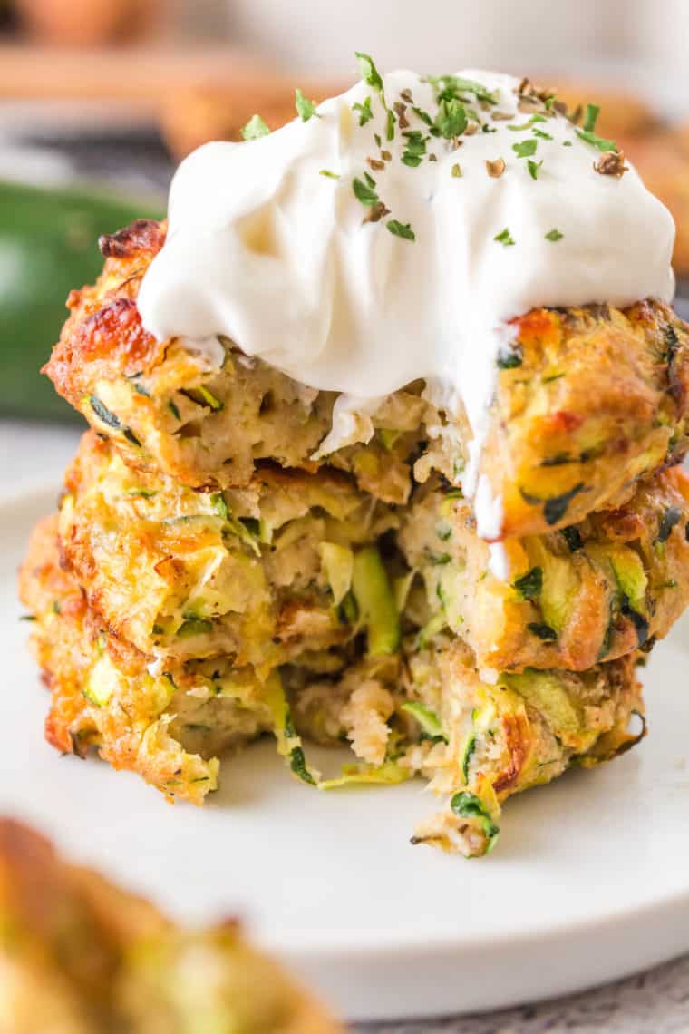 Discover the best Air Fryer Zucchini Fritter recipe, a game-changer for all fritter enthusiasts! These fritters are the perfect blend of health and taste, offering a crispy exterior and a soft, flavorful interior, all without the excess oil of traditional frying. Made with fresh zucchini, these fritters are delicious and a great way to incorporate more vegetables into your diet. The air fryer technology ensures that each fritter is cooked evenly, achieving that sought-after crunch with minimal oil, making it a healthier alternative for those conscious about their food choices.



This recipe stands out for its simplicity and versatility. You can easily customize the zucchini cakes by adding your favorite herbs, spices, or cheese, making it a flexible option for various tastes. These zucchini fritters are bound to be a hit, whether serving them as a savory snack, a side dish, or even a light main course. They're particularly perfect for summer evenings when zucchini is in abundance, but their ease and tastiness make them a year-round treat. Try this Air Fryer Zucchini Fritter recipe, and get ready to be wowed by how delicious healthy eating can be!