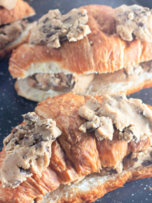 1. Chocolate chip cookie croissants baked golden brown on a parchment-lined baking sheet
