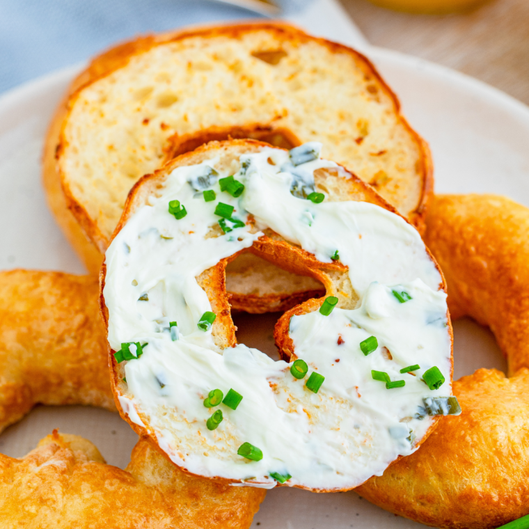 Bagel topped with creamy homemade cream cheese spread.