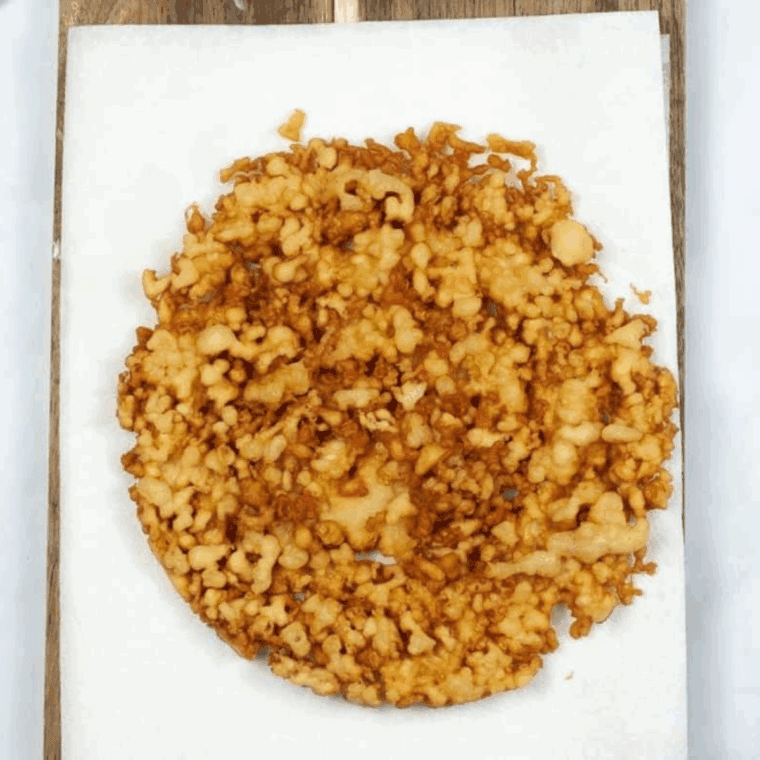 Golden, crispy Instant Pot Funnel Cakes dusted with powdered sugar, ready to be enjoyed as a classic carnival-style treat.
