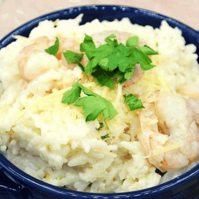 Creamy shrimp risotto with tender shrimp and Parmesan cheese served in a bowl, made in the Ninja Foodi.