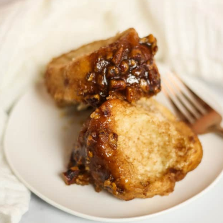 "Serving Air Fryer Pecan Monkey Bread with a caramelized glaze"