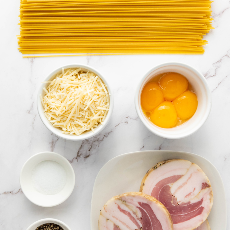 Ingredients needed for Slimming World friendly Spaghetti Carbonara on kitchen table.