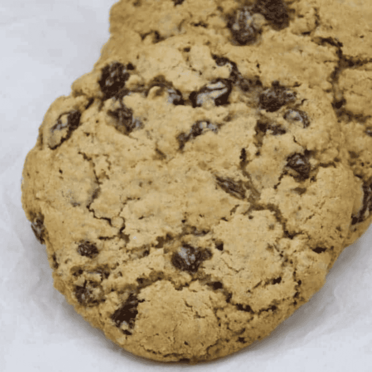 Freshly baked Subway-style oatmeal raisin cookies with golden edges and chewy centers.
