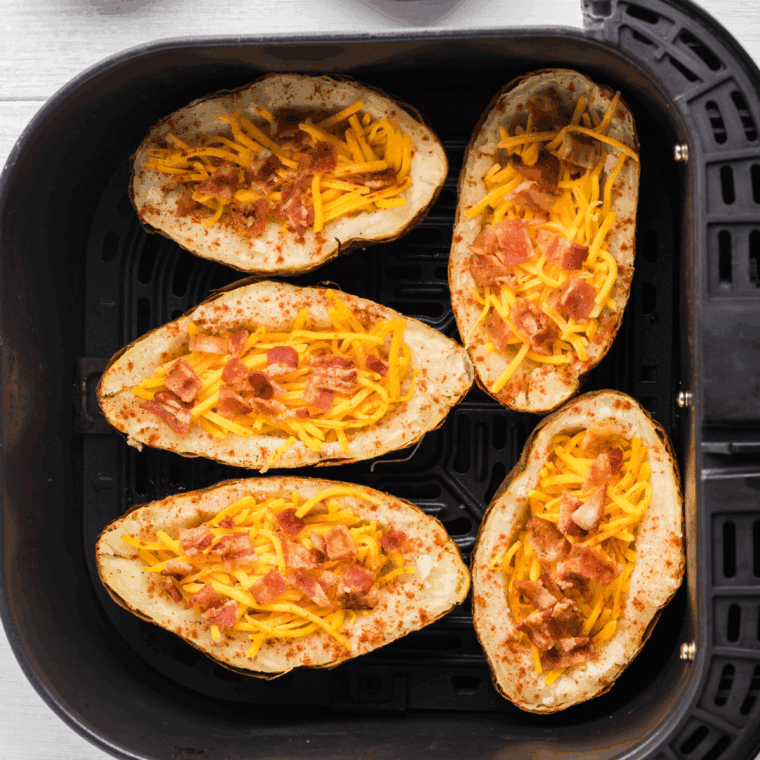 Fill the potatoes and place them back into the air fryer basket.