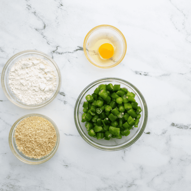 Ingredients needed for Air Fryer Fried Okra on kitchen table.