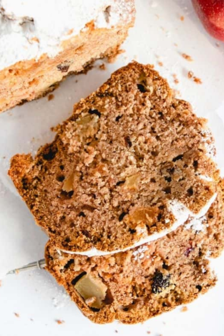 Close-up crumb shot of apple cranberry bread with visible walnut pieces
