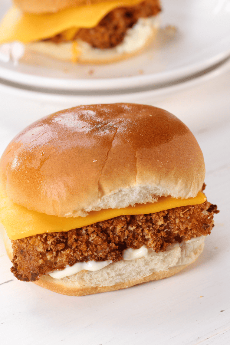 Crispy breaded fish fillets cooked in an air fryer for a delicious homemade Filet-O-Fish sandwich with tartar sauce and a soft bun.