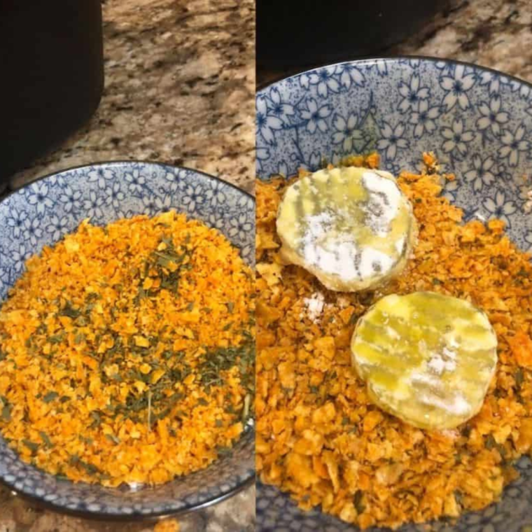 Placing the crushed Doritos in a bowl, and placing them on the pickles.