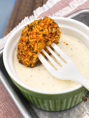 Air fryer Doritos fried pickles on a platter with ranch for dipping