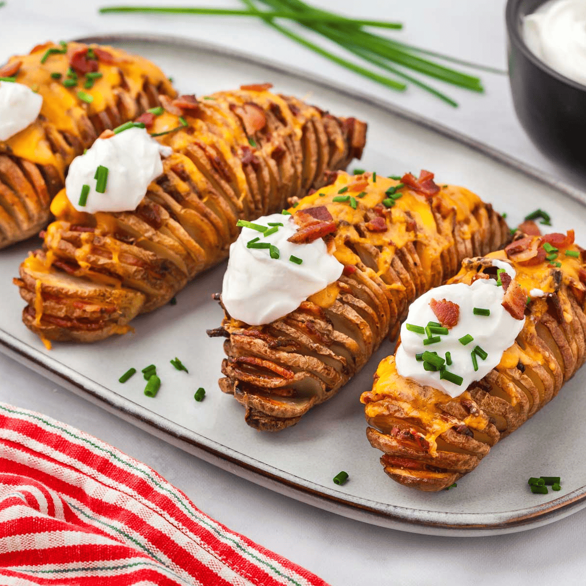 Close-up of Air Fryer Garlic Butter Hasselback Potatoes garnished with fresh parsley.