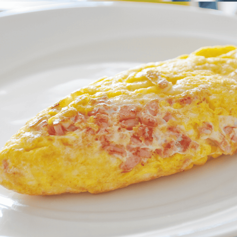 Close-up of cheesy ham omelette cooked in air fryer