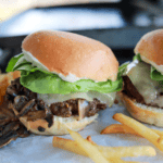 Air Fryer Mushroom & Swiss Burgers with sautéed mushrooms, melted Swiss cheese, and beef patty.